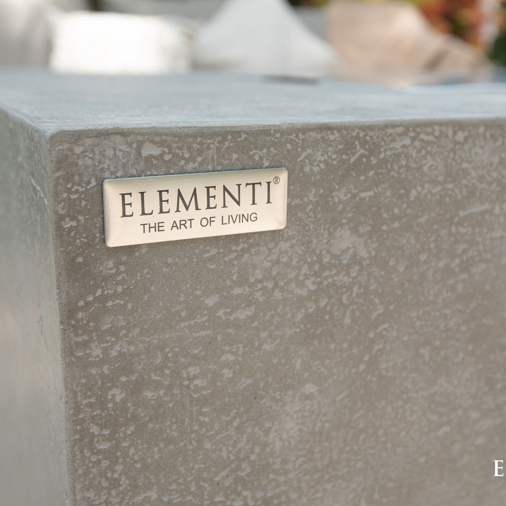 Elementi Andes Fire Table Light Gray - Cast Metal Elementi Emblem and Smooth Concrete Finish Detail