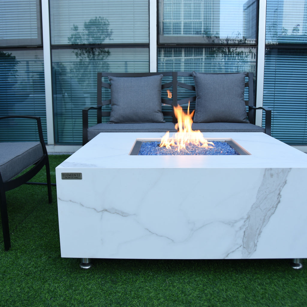 Elementi Plus Bianco Fire Table - Modern Outdoor Terrace Setting with Burning Fire and Lounge Furniture
