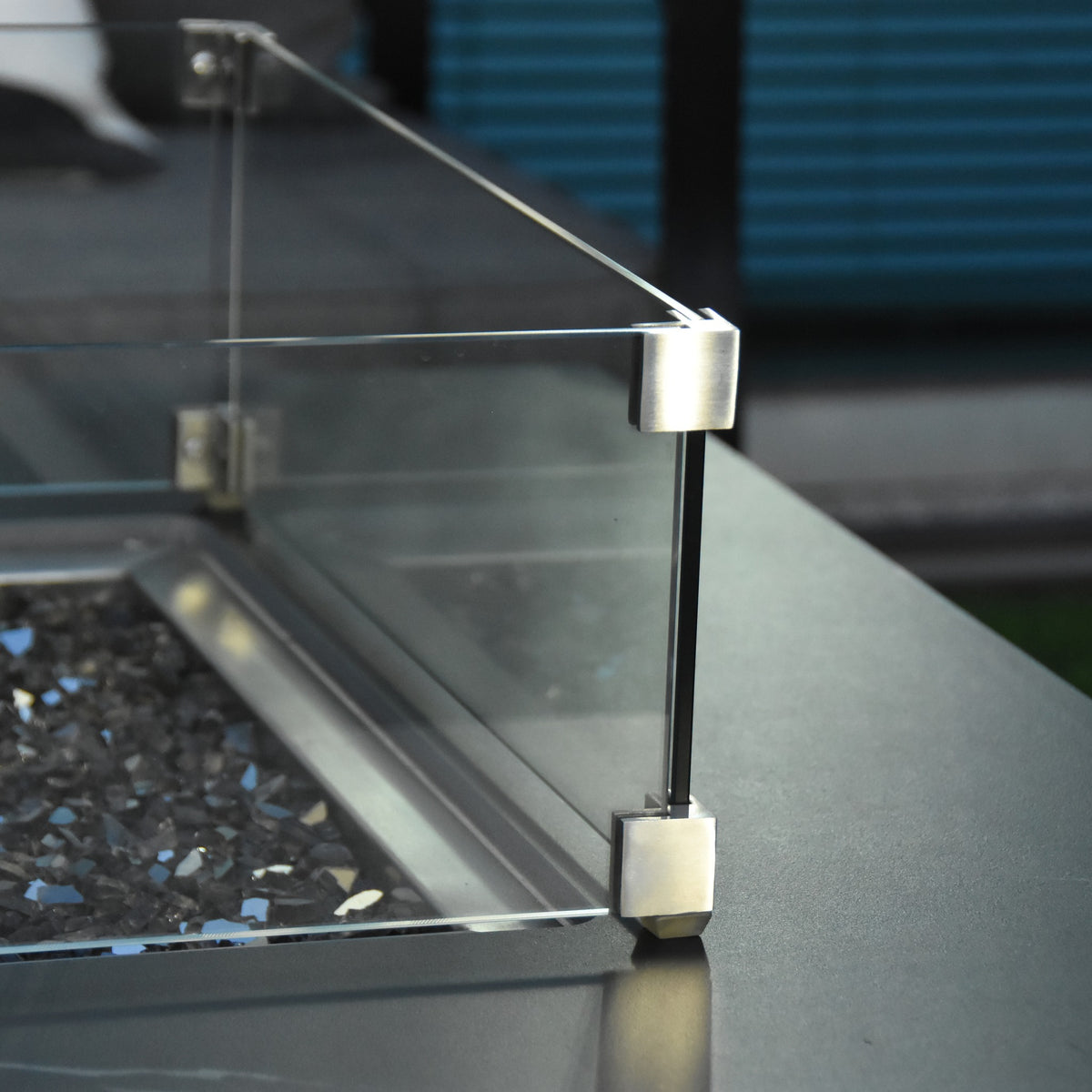 Elementi Plus Sofia Fire Table - Stainless Steel Windscreen Clamp & Bronze Fire Glass Macro Detail