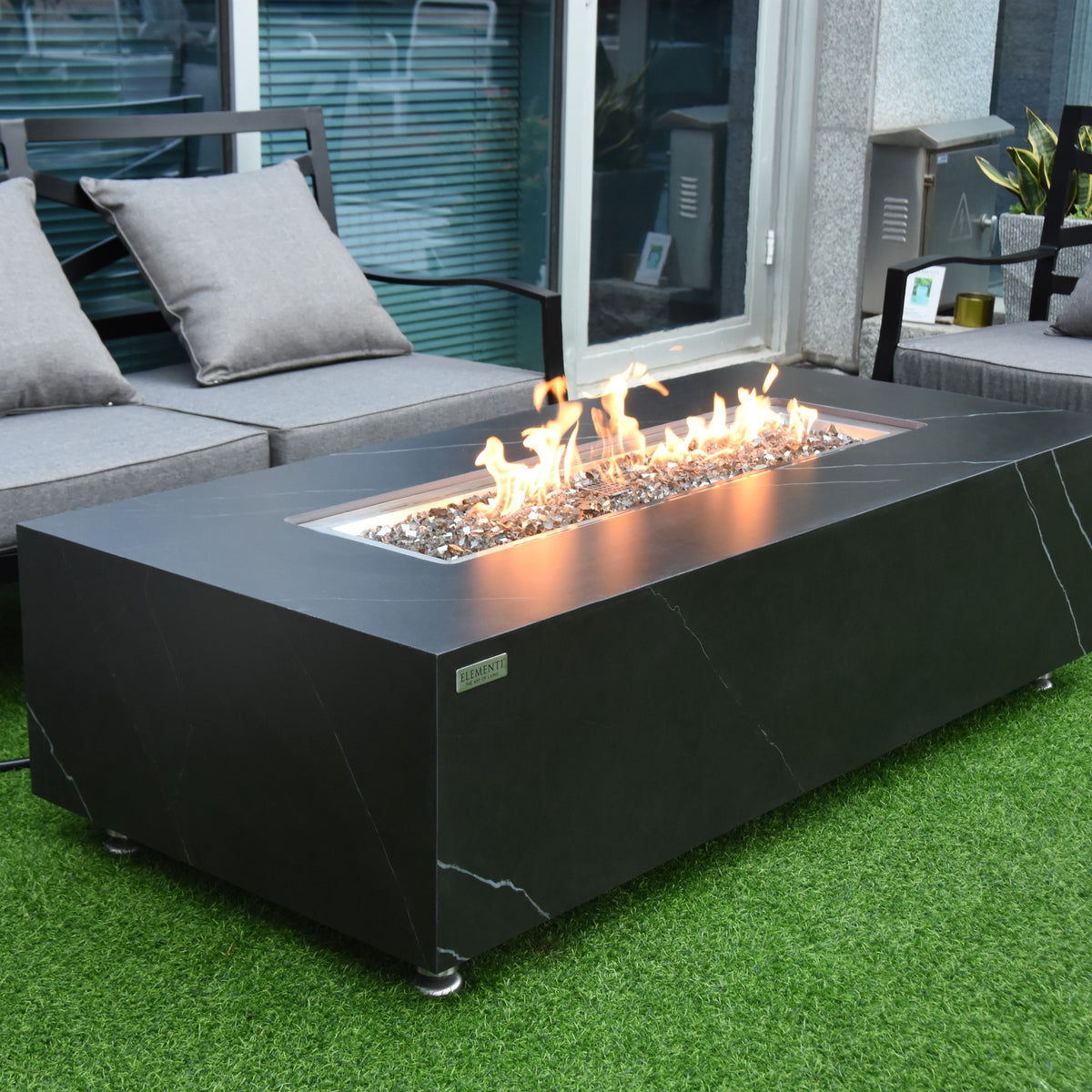 Elementi Plus Varna Fire Table - Outdoor Patio Lifestyle Setting with Natural Flames