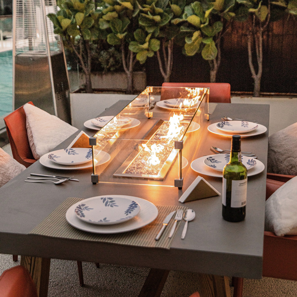 Elementi Sonoma Dining Fire Table - Close-Up with Glass Windscreen & Dinner Table Setting - Elementi Fires