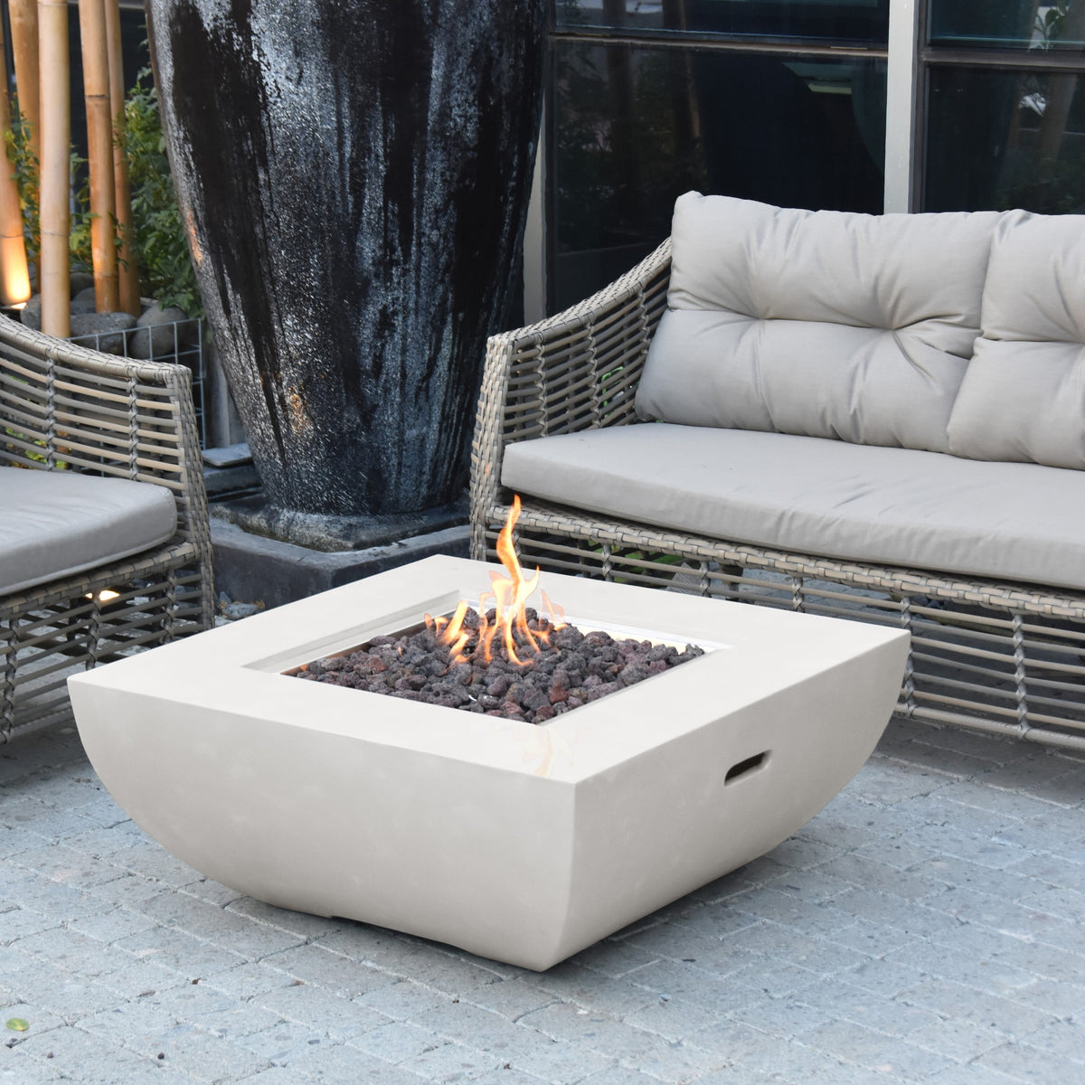 Modeno Florence Fire Table Cream White - Outdoor Stone Terrace with Wicker Armchairs and Active Fire Pit